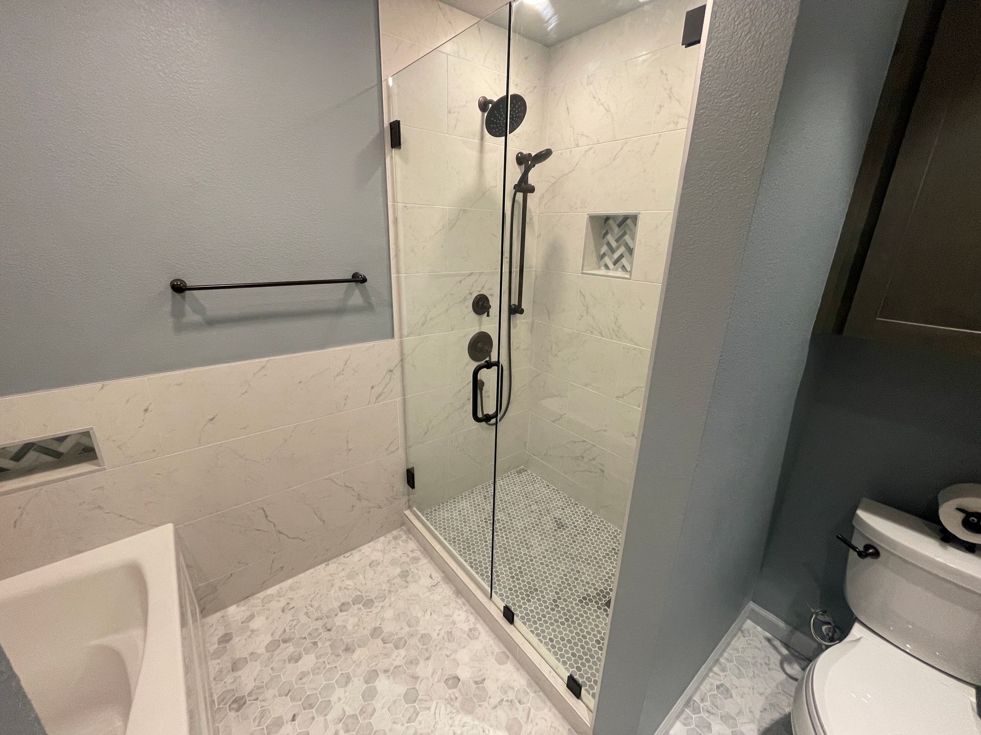 Tulsa Bathroom remodel spa shower stained glass mosaic tile inset marble floor gothic black granite counter