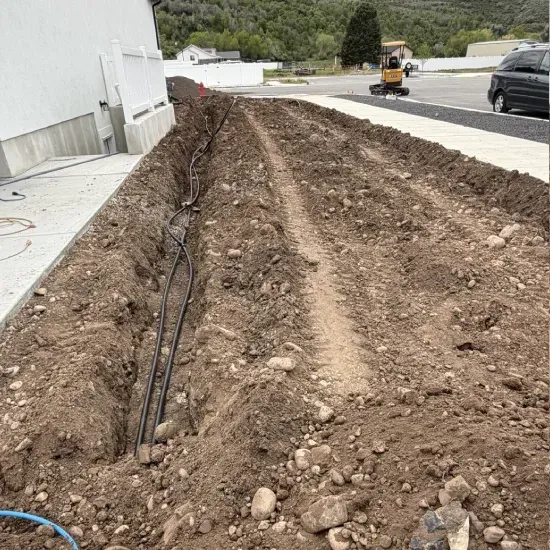 Residential drainage correction service in Ogden UT improving water flow and reducing lawn erosion issues