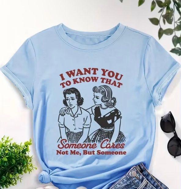 Light blue T-shirt with red and black text and a retro couple illustration reading “I want you to know that”