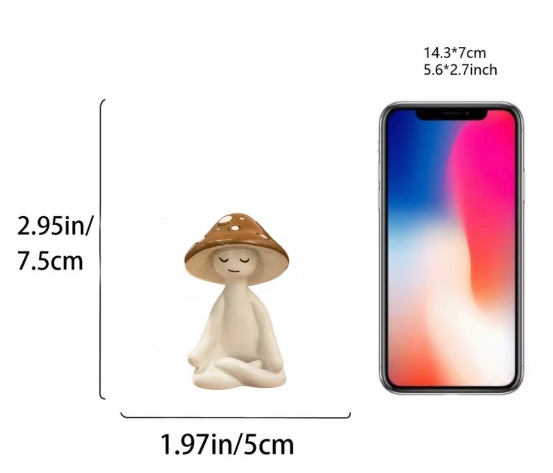 Small white figurine meditating on green grass, wearing a brown mushroom cap hat.
