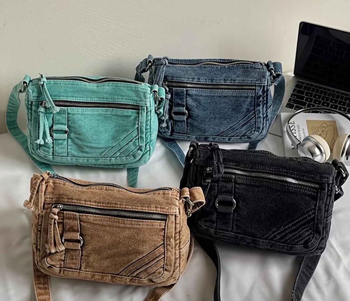 Four quilted crossbody bags in mint, blue denim, tan, and black on a light surface.