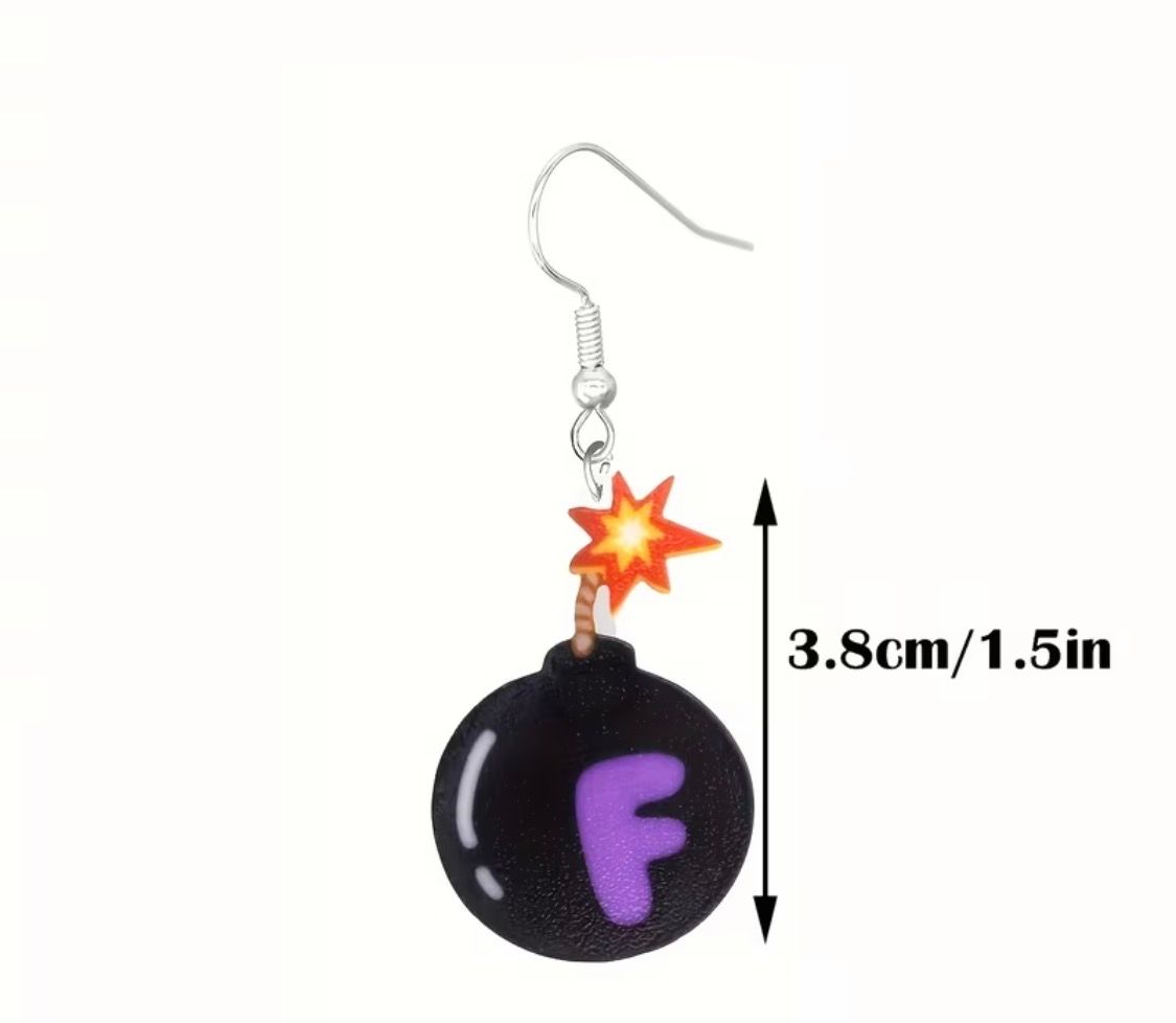 Two cartoon black bombs with lit fuses and purple F letters on a pink and blue speckled wall