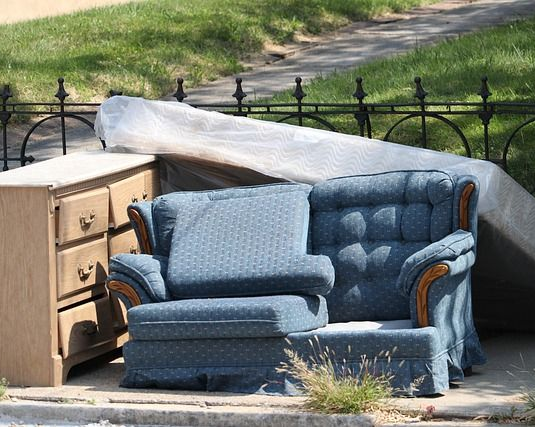 Couch being removed from Jackson home
