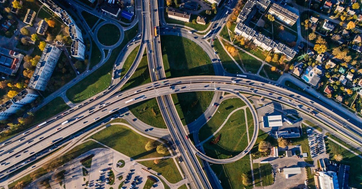 An aerial view of a busy highway intersection in a city.