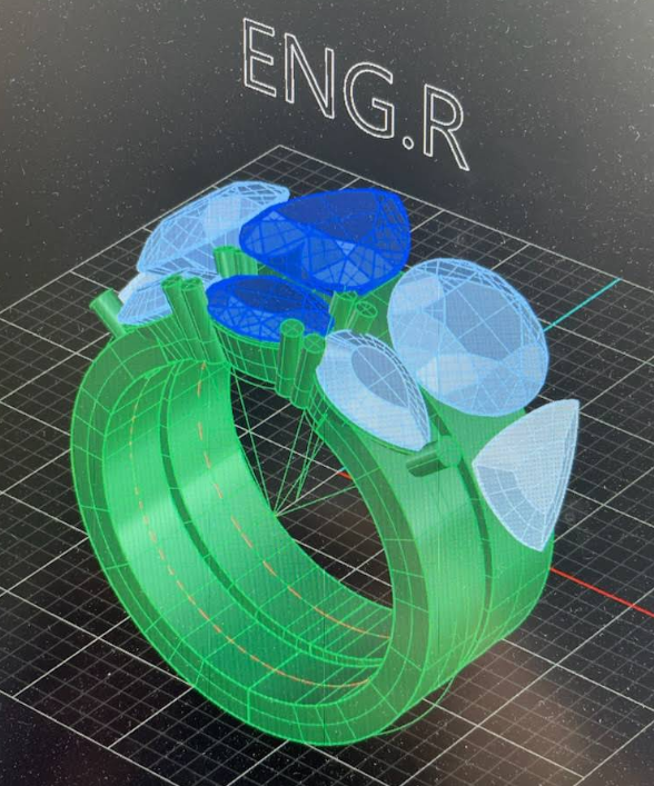 A 3d model of a green ring with blue and white diamonds