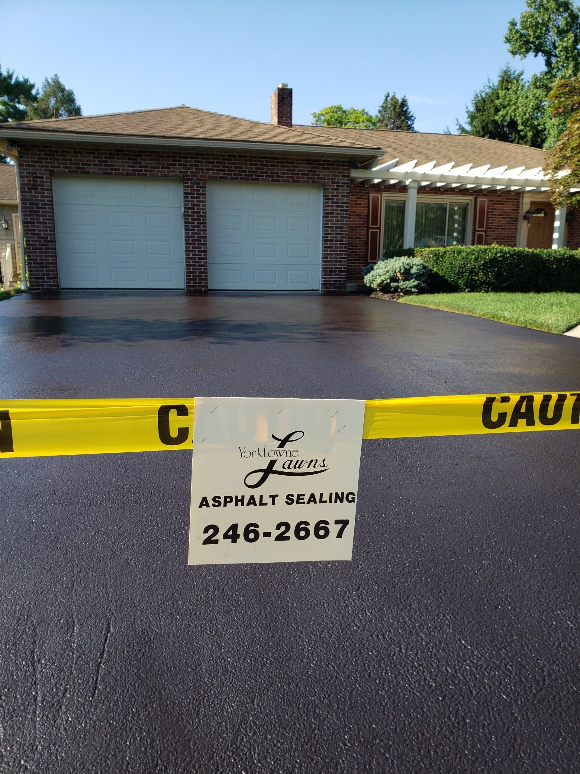 Newly Sealed Pavement Front — Windsor, PA — Yorktowne Lawns Inc.