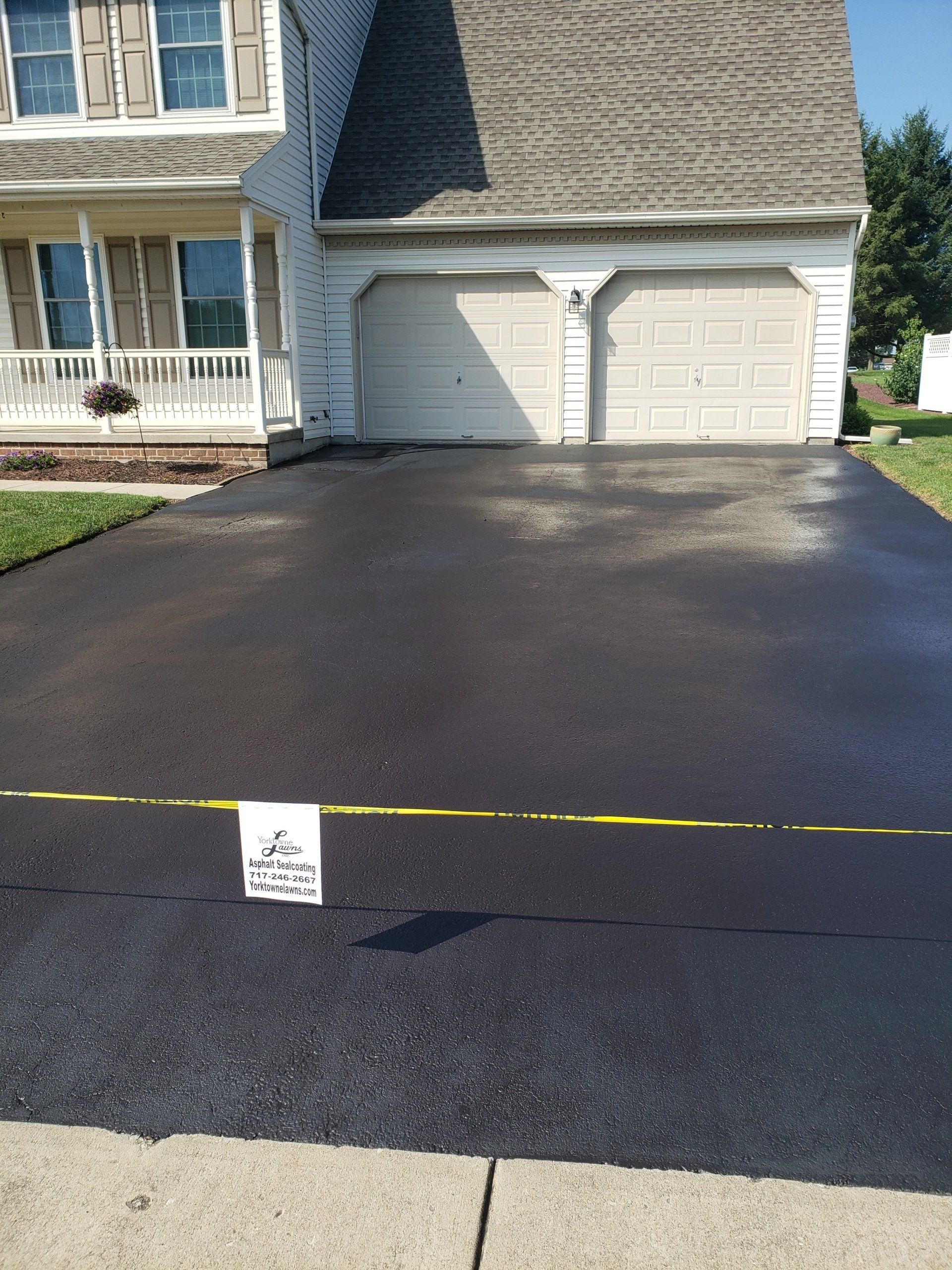 Sealcoating In Front Of The House — Windsor, PA — Yorktowne Lawns Inc.