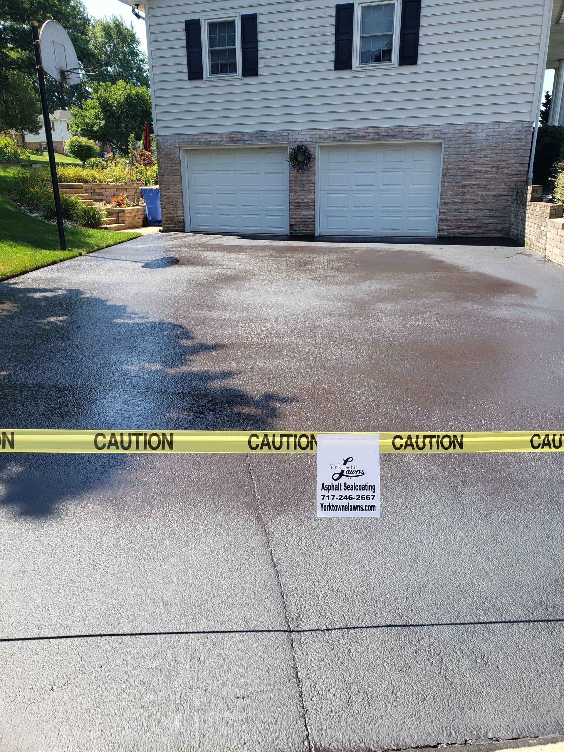 Asphalt Sealing In Front Of The House — Windsor, PA — Yorktowne Lawns Inc.