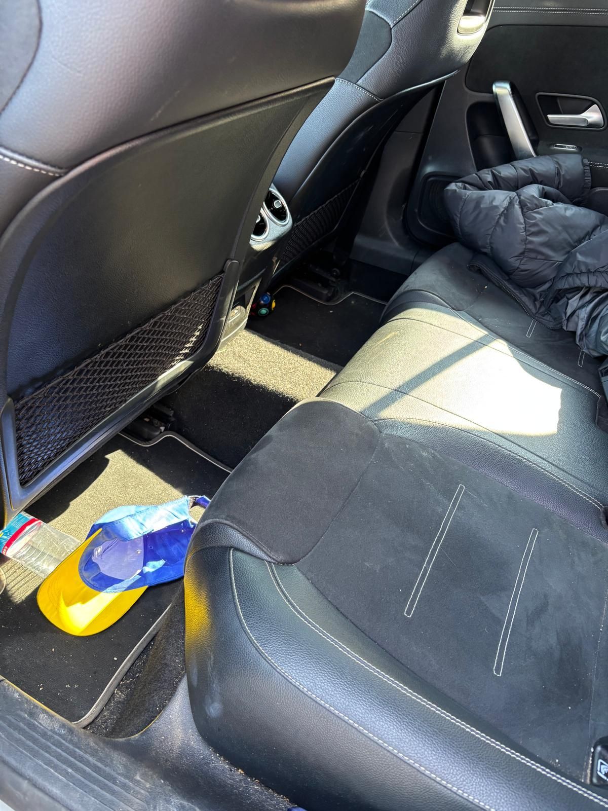 The interior of a range rover sport with white leather seats and a steering wheel has been detailed.