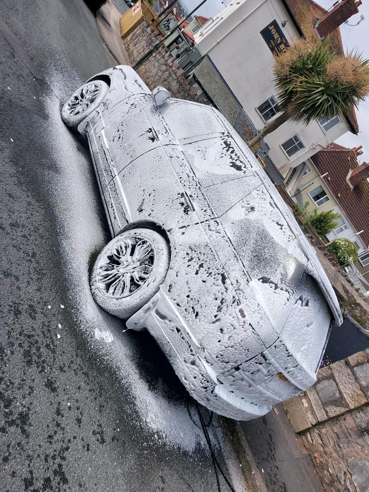 A silver range rover sport has been valeted.