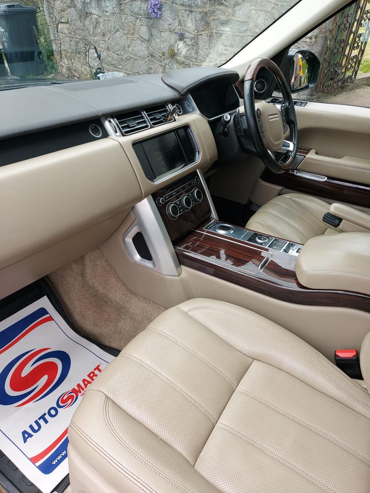 A silver range rover sport has been valeted.