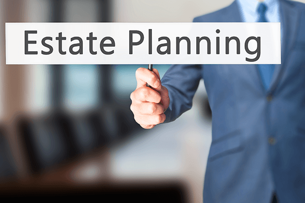 Man Holding Estate Planning Tag — Medina County, OH — Laribee & Hertrick, LLP