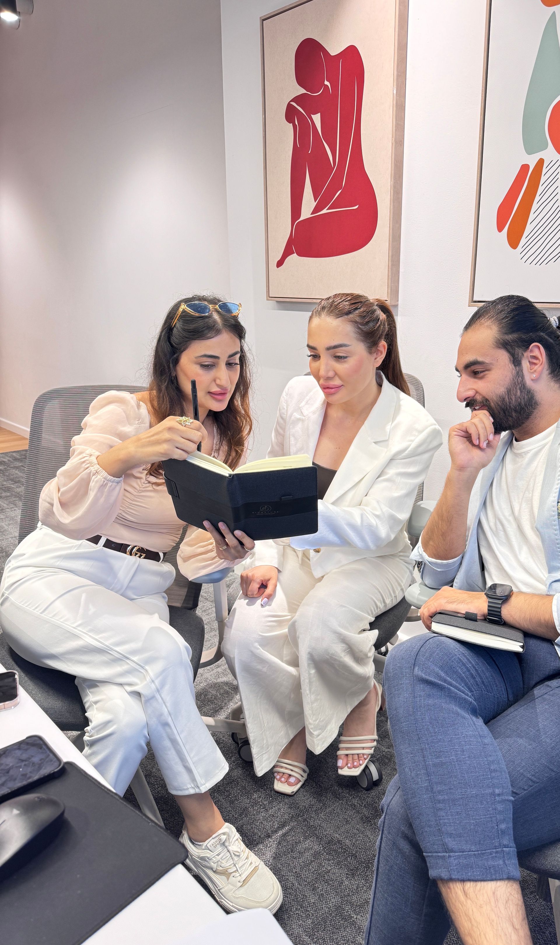 Small business owner and advisor reviewing a marketing proposal together at a table