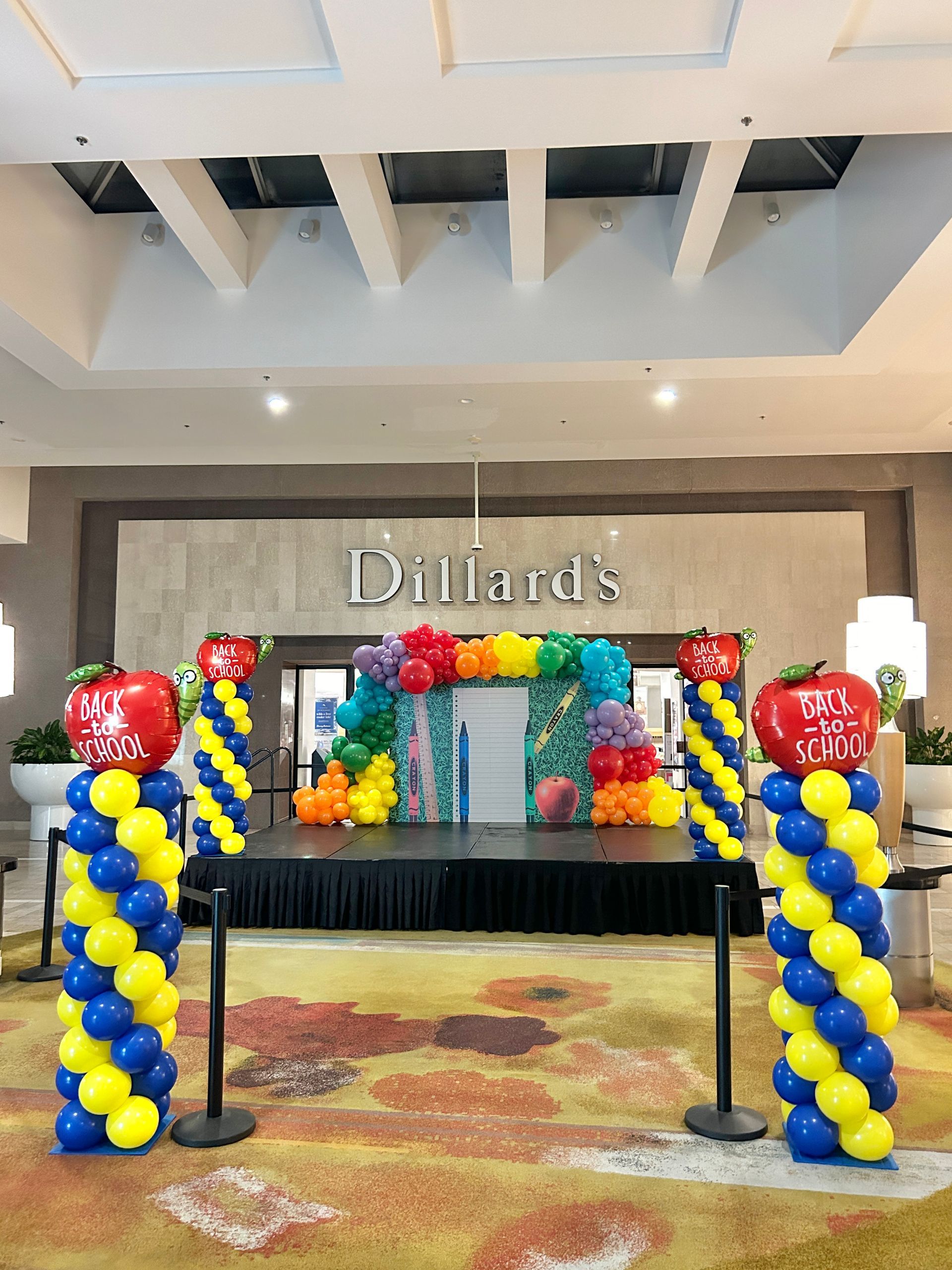 A pink hospital decorated with balloons and flowers for a birthday party.