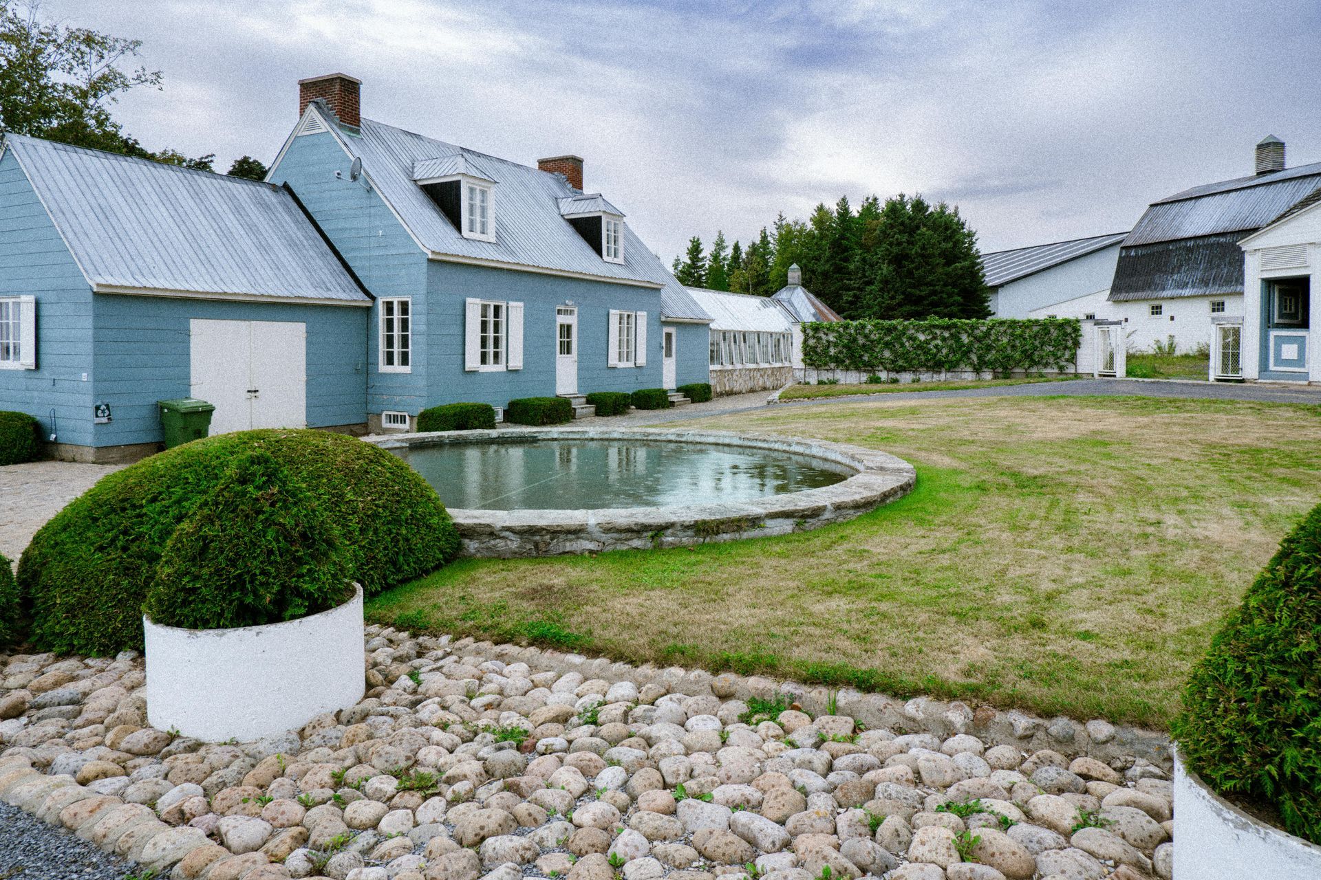 A yellow bulldozer is moving dirt in a forest.