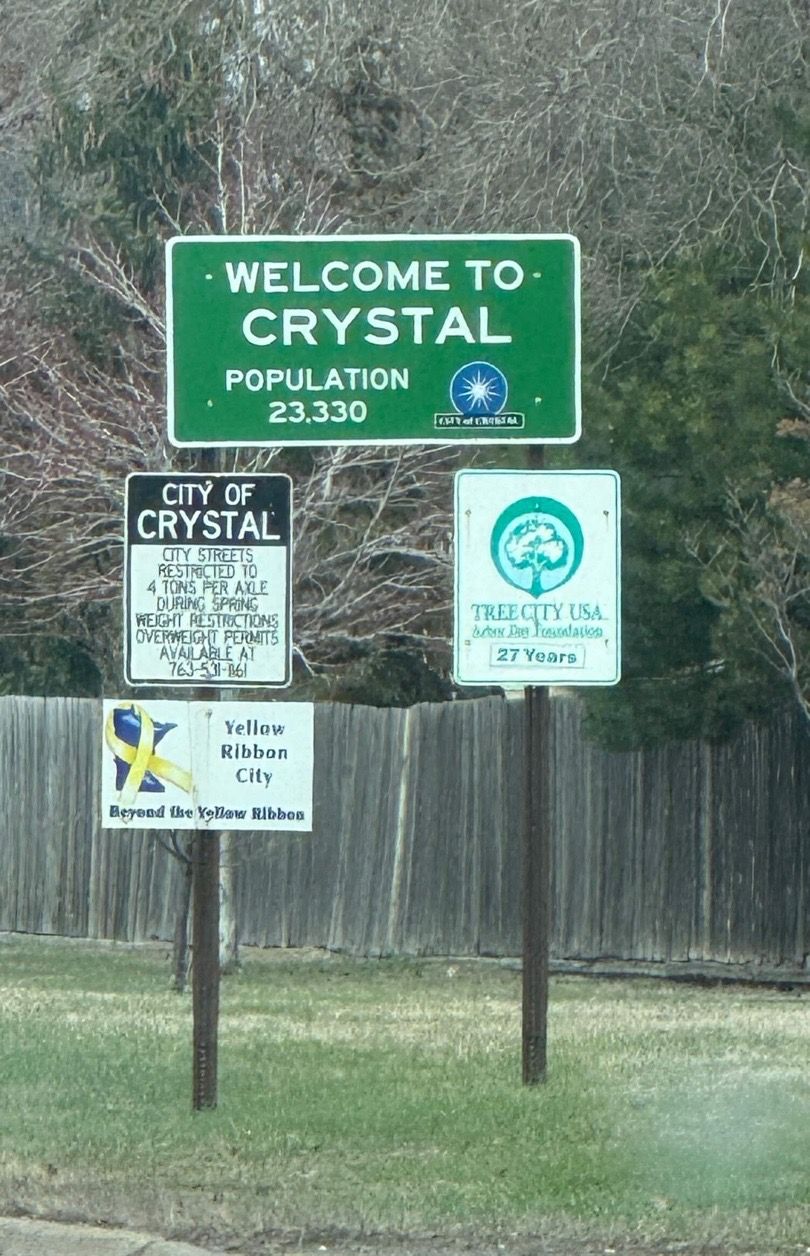 movers took picture of crystal, mn city sign