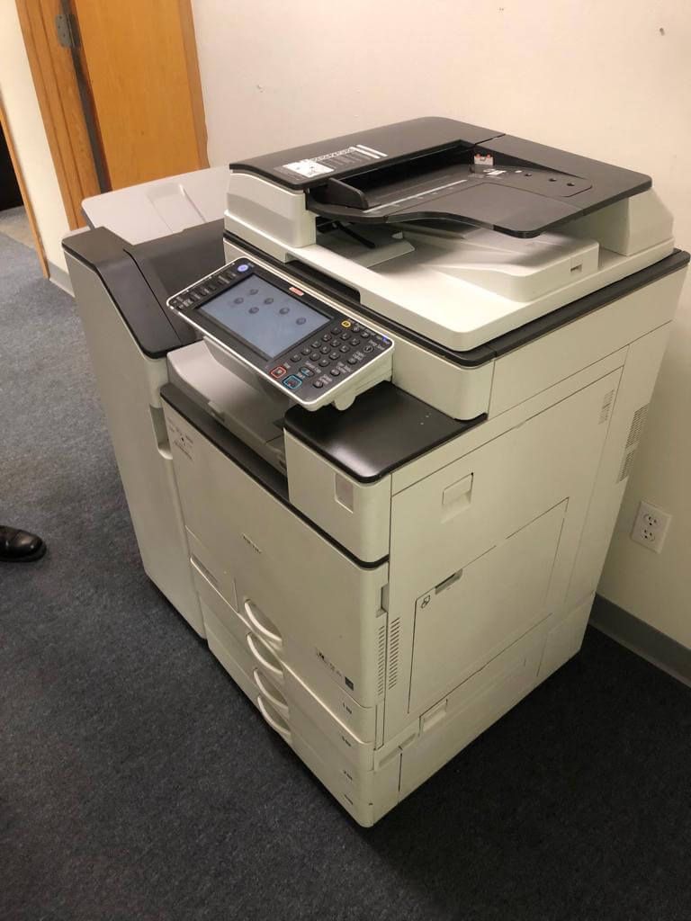 Commercial movers in Crystal Minnesota moving a upright printer