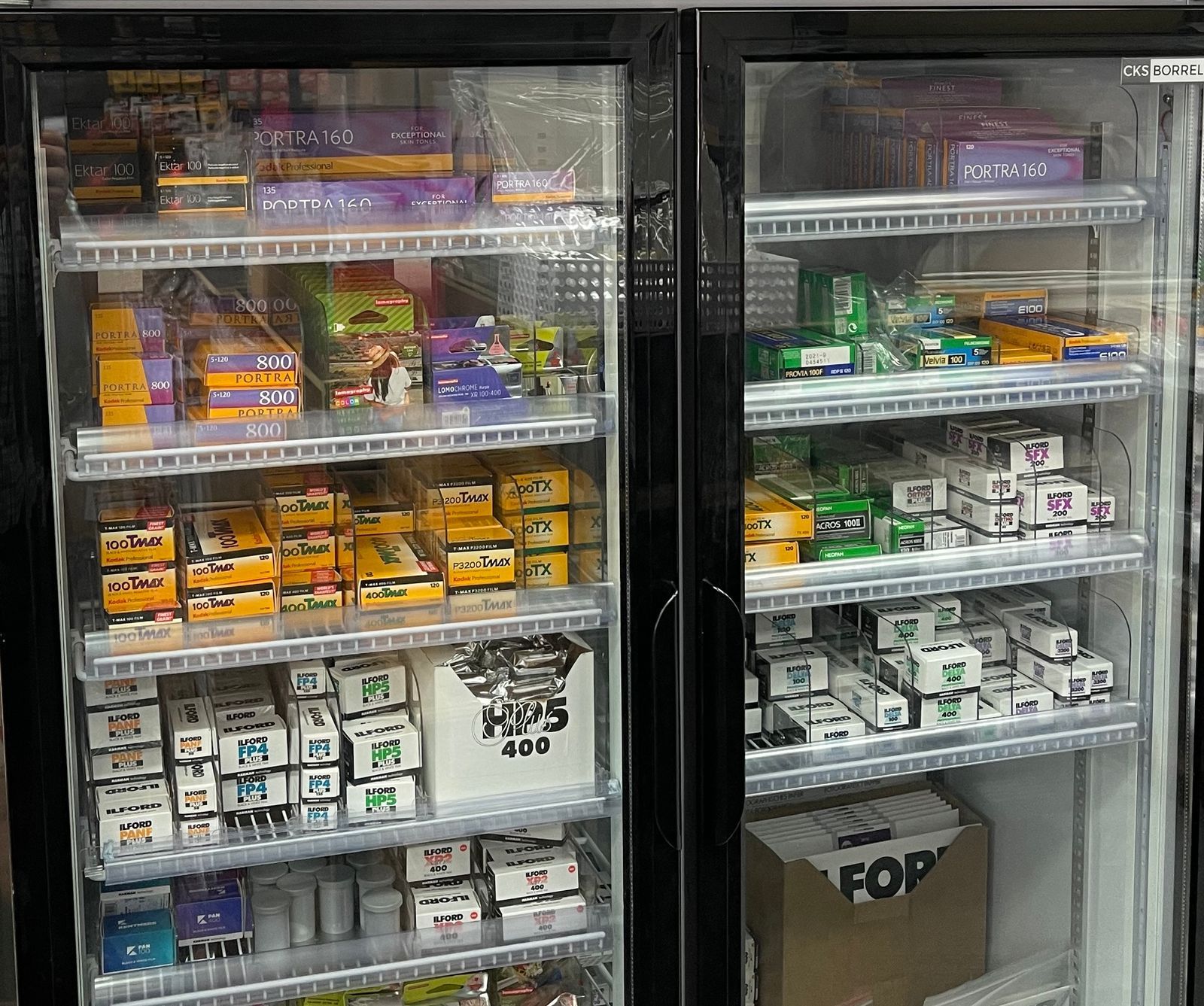 a person is holding a roll of film in their hand .