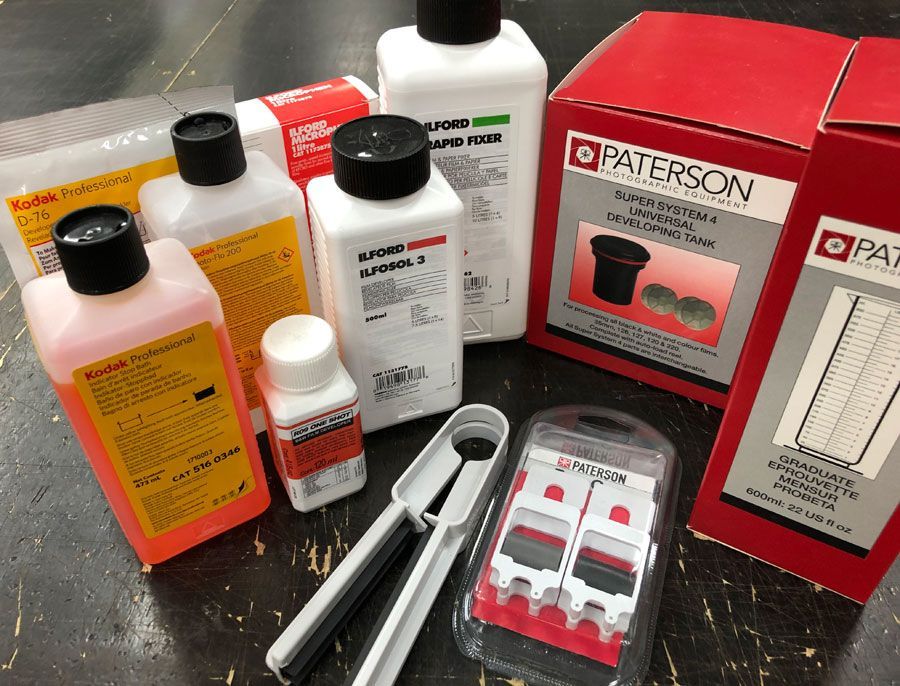 a person is holding a roll of film in their hand .