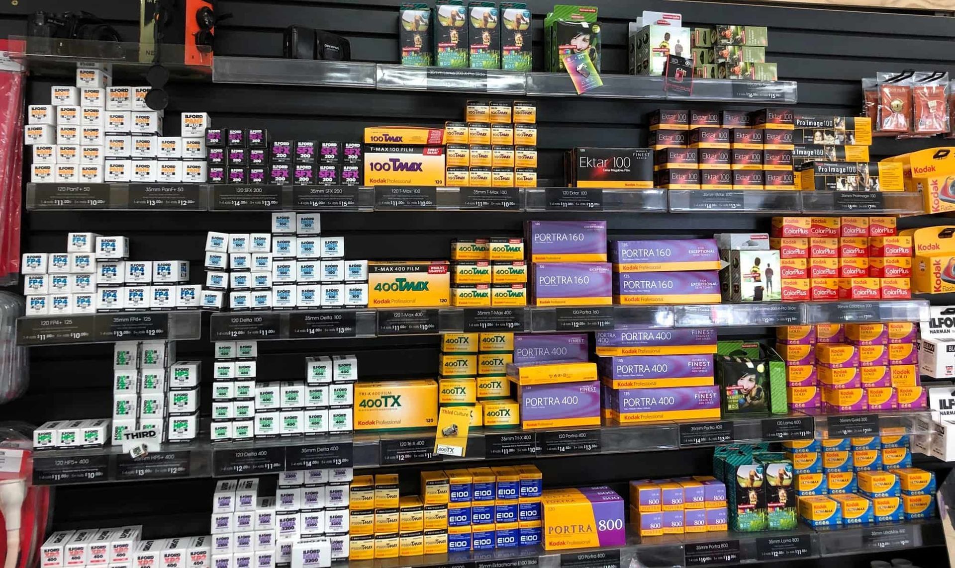 a person is holding a roll of film in their hand .