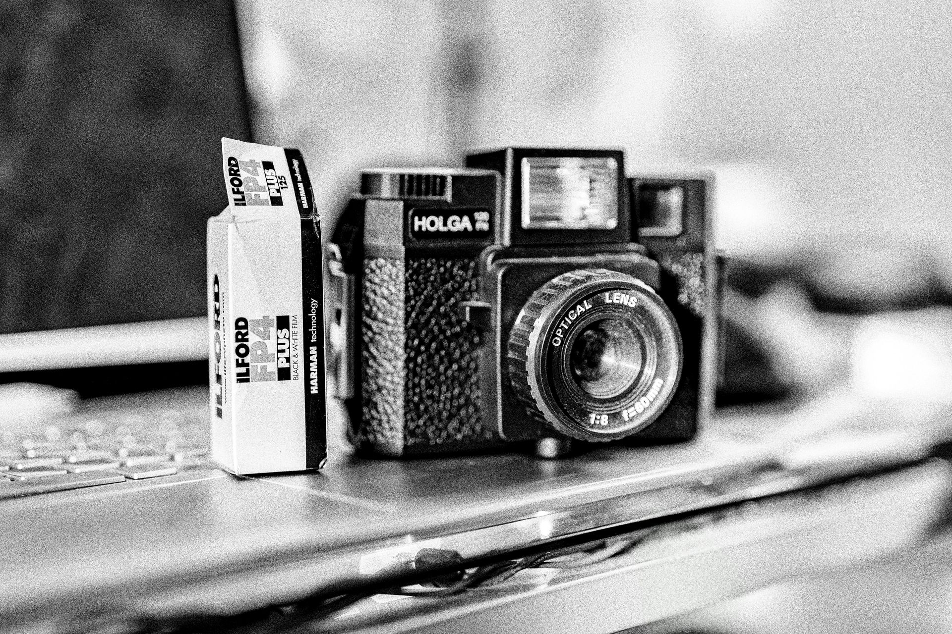 a person is holding a roll of film in their hand .