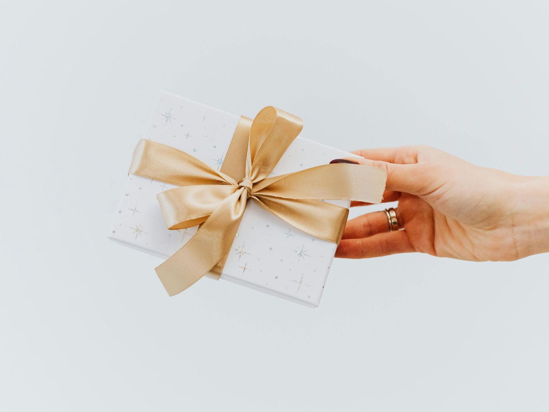 a person is holding a roll of film in their hand .