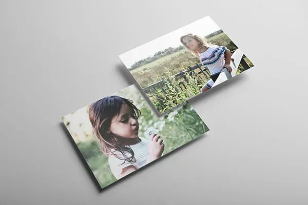 a person is holding a roll of film in their hand .