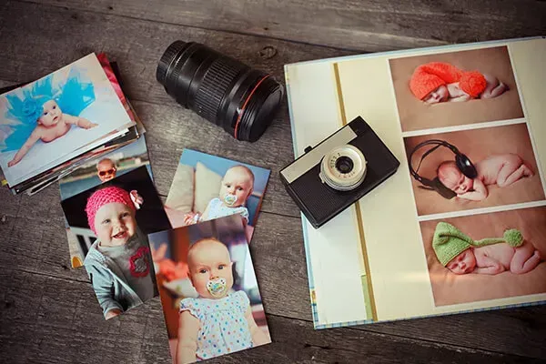 a man in a trench coat is standing next to a woman in a chair