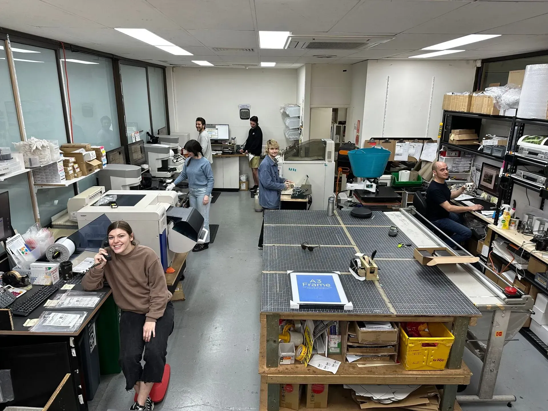 a sony camera is surrounded by lenses and a tripod