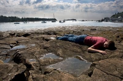 a person is holding a roll of film in their hand .