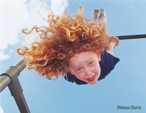 a person is holding a roll of film in their hand .