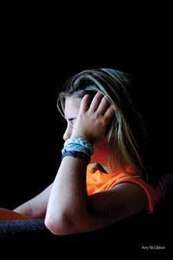 a person is holding a roll of film in their hand .