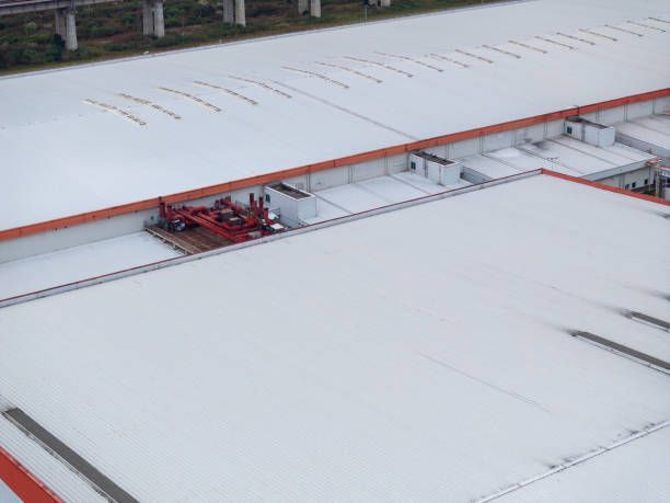 Aerial view of the rooftops of industrial buildings.