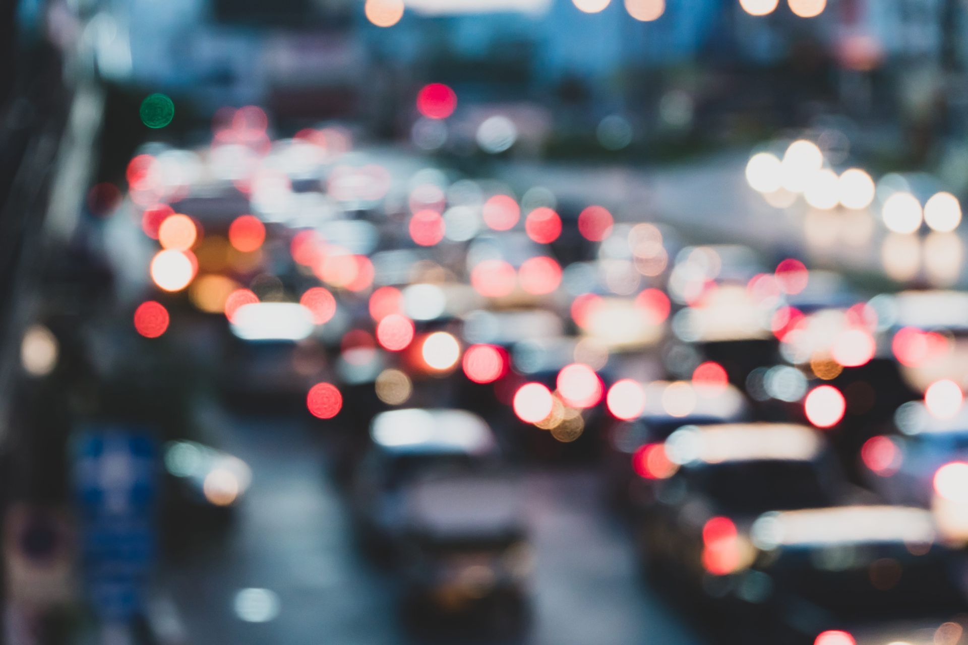 Traffic jam at dusk, with blurred car headlights and taillights.