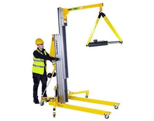 ToughLift Boom accessory fitted to machine lifting a hydraulic cylinder. 
