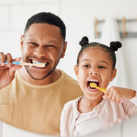 Father And Daughter Brushing Their Teeth — Melbourne, FL — Theodore G. Schropp, DDS