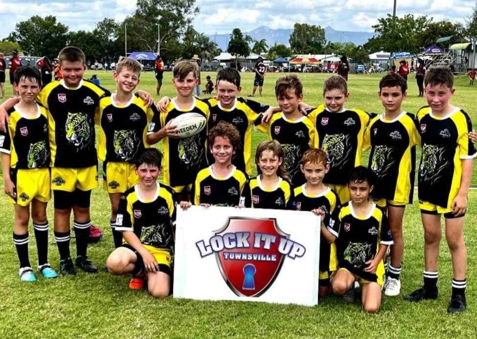 A Person Is Holding A Car Key In Front Of A White Truck — Lock It Up Townsville In Aitkenvale, QLD