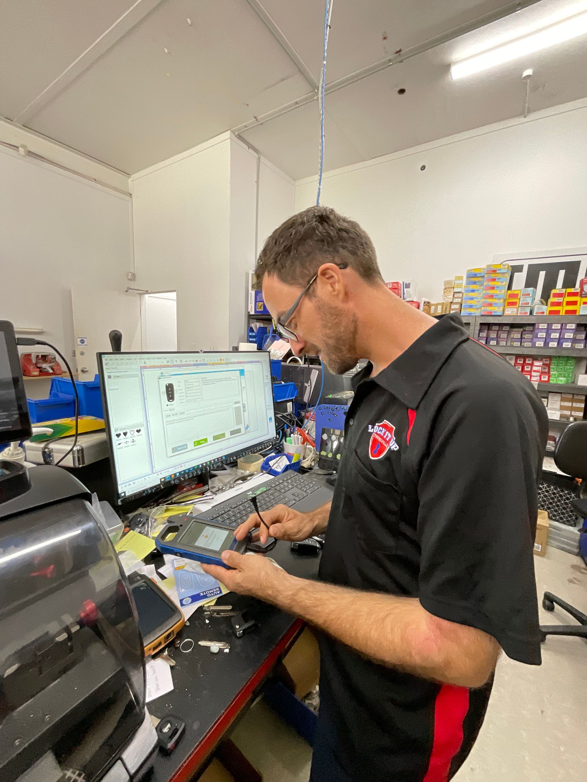 A Bunch Of Keys Are Hanging On A Board That Says Creative House Keys — Lock It Up Townsville In Aitkenvale, QLD