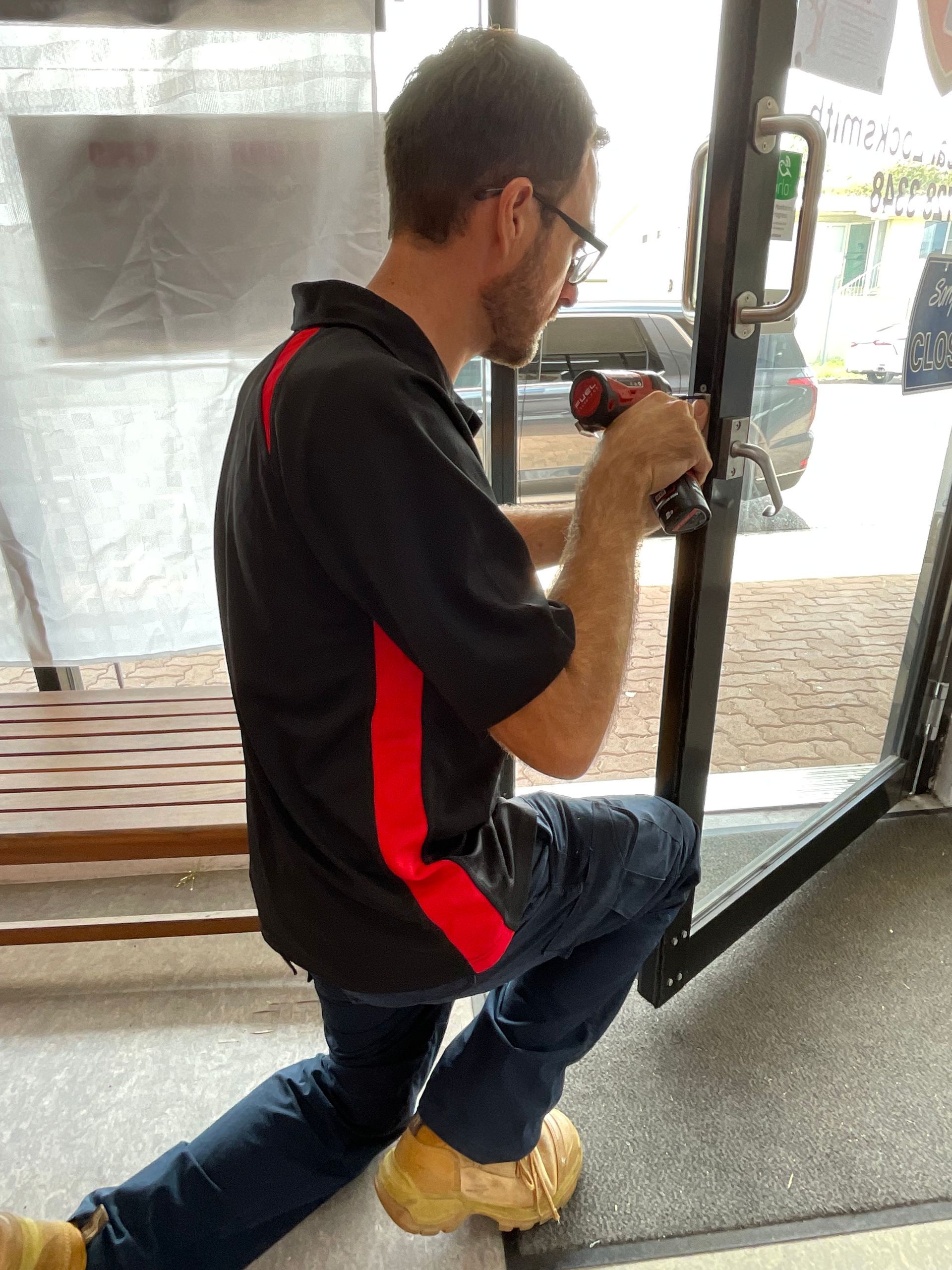 Locksmith at work on a lock for a door— Lock It Up Townsville In Aitkenvale, QLD