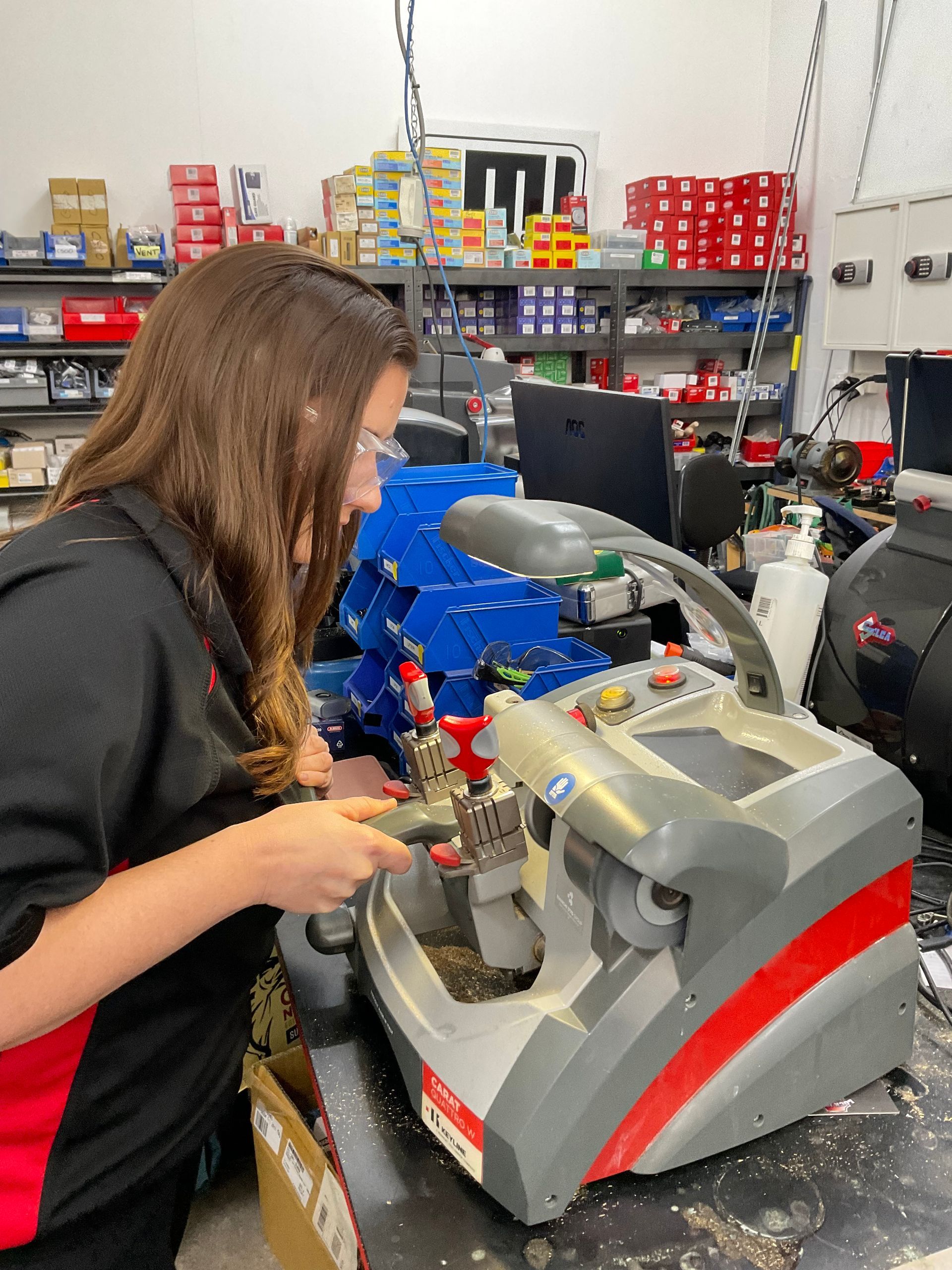 A Man Wearing A Shirt That Says Your Local Locksmith — Lock It Up Townsville In Aitkenvale, QLD