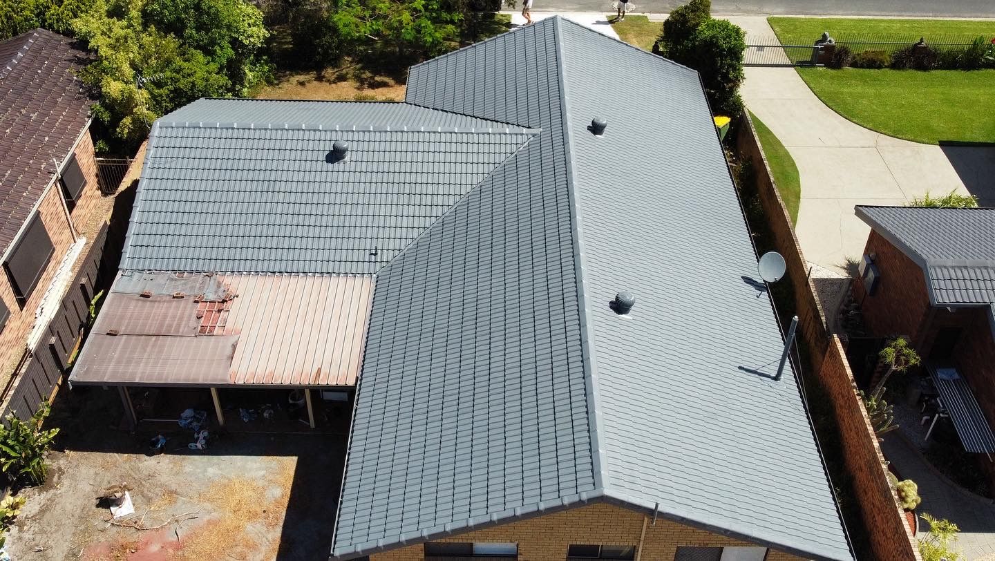 Man Cleaning House Metal Roof - Roof Painting in Gold Coast,QLD