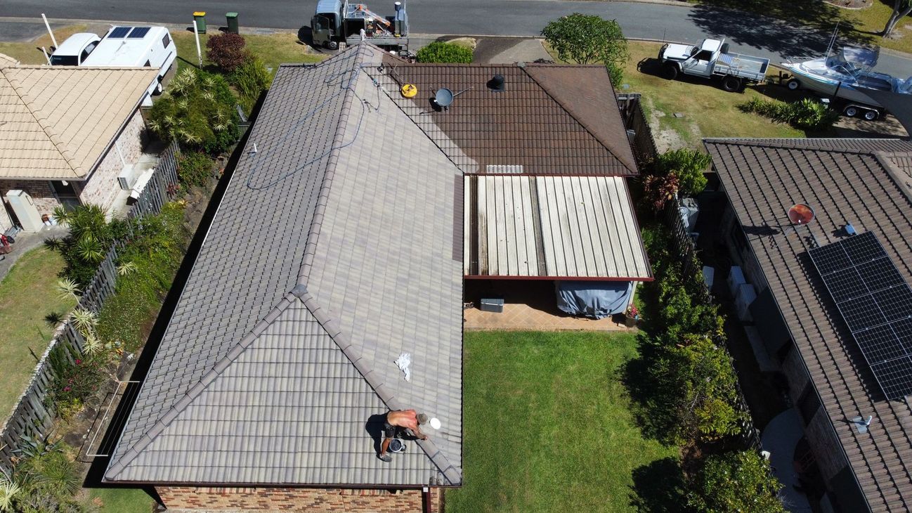 Worker Holding Old Roof - Roof Painting in Gold Coast,QLD