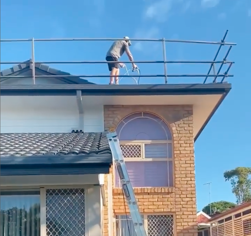 Handyman Working on Roof - Roof Painting in Gold Coast, QLD