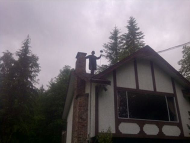 Man Beside The House Chimney