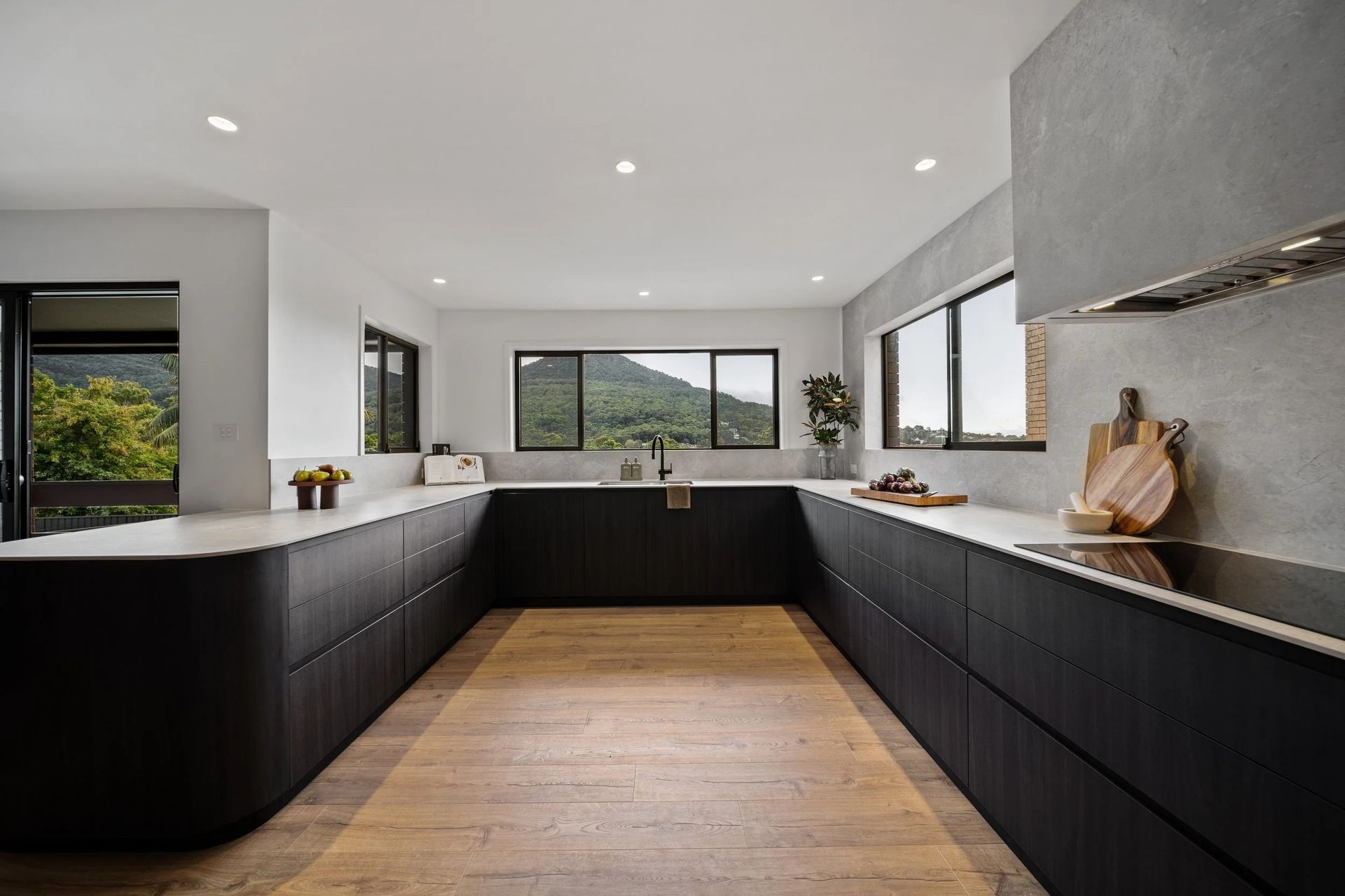 Modern Kitchen With Dark Cabinetry — Onyx Detailed Joinery in Unanderra, NSW