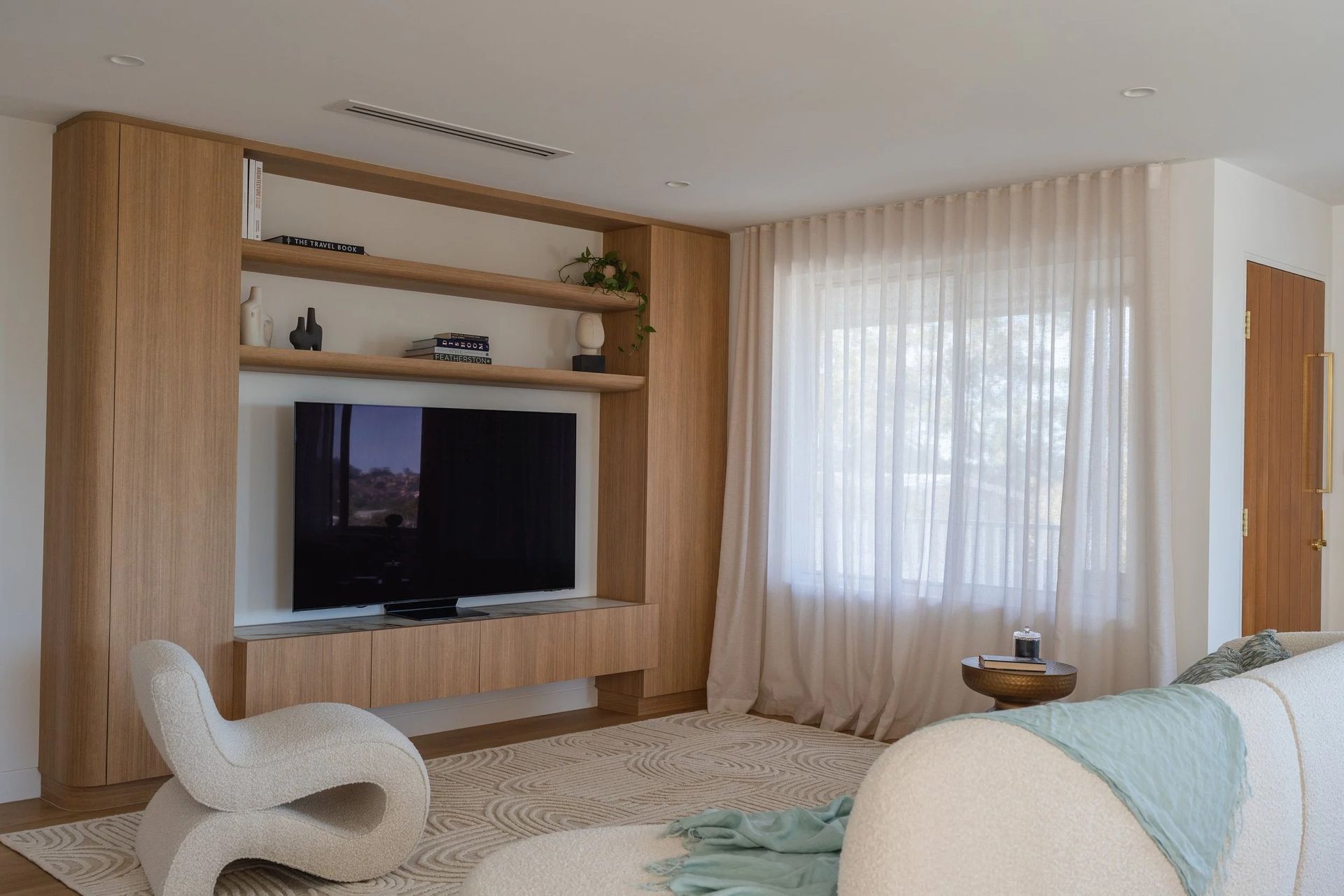 Living Room With a Wooden Entertainment Center — Onyx Detailed Joinery in Unanderra, NSW