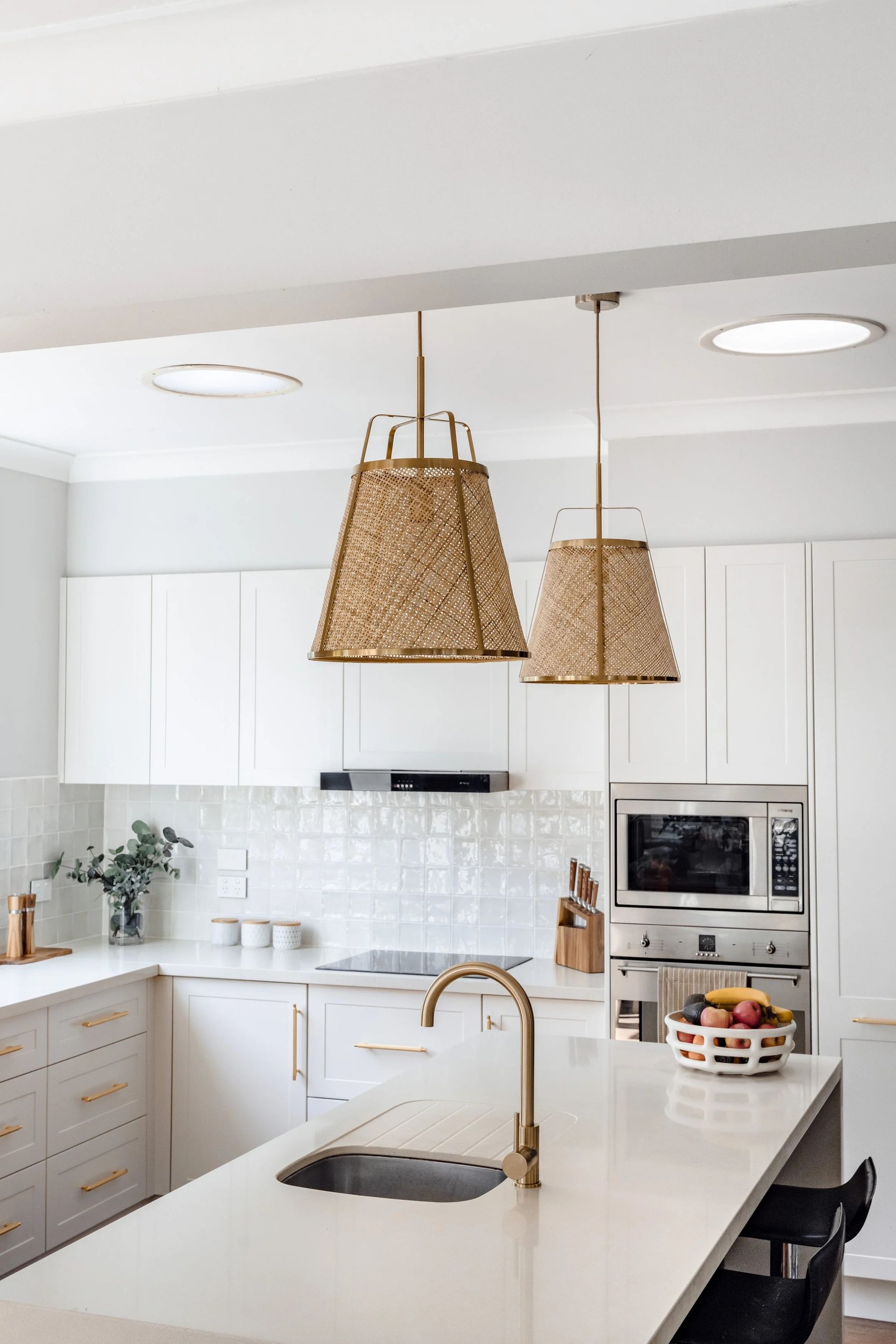 White Kitchen With Gold Fixtures — Onyx Detailed Joinery in Unanderra, NSW