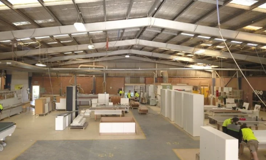 Inside a Woodworking Factory; Workers Near Cabinets — Onyx Detailed Joinery in Unanderra, NSW
