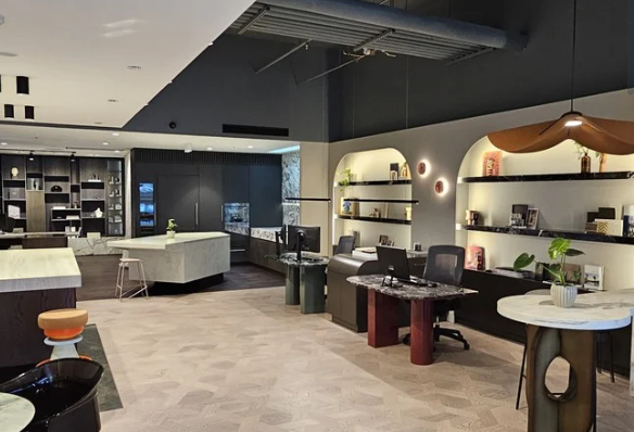 Modern office space with sleek black desks, warm lighting, and decorative shelves — Onyx Detailed Joinery In Unanderra, NSW