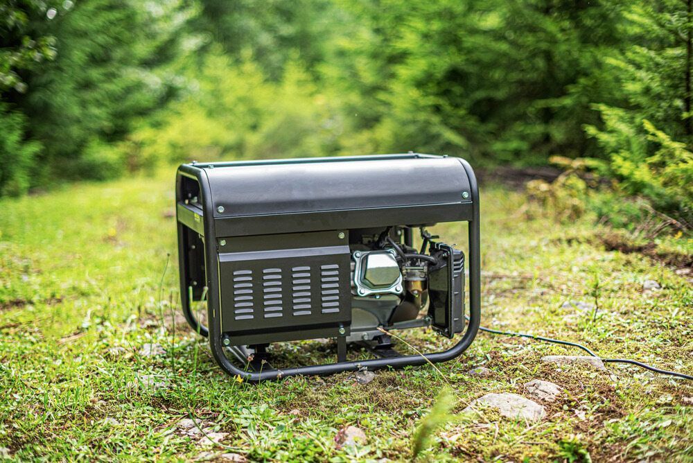 A Small Generator is Sitting on Top of a Lush Green Field — Chaffey Power in West Mackay, QLD